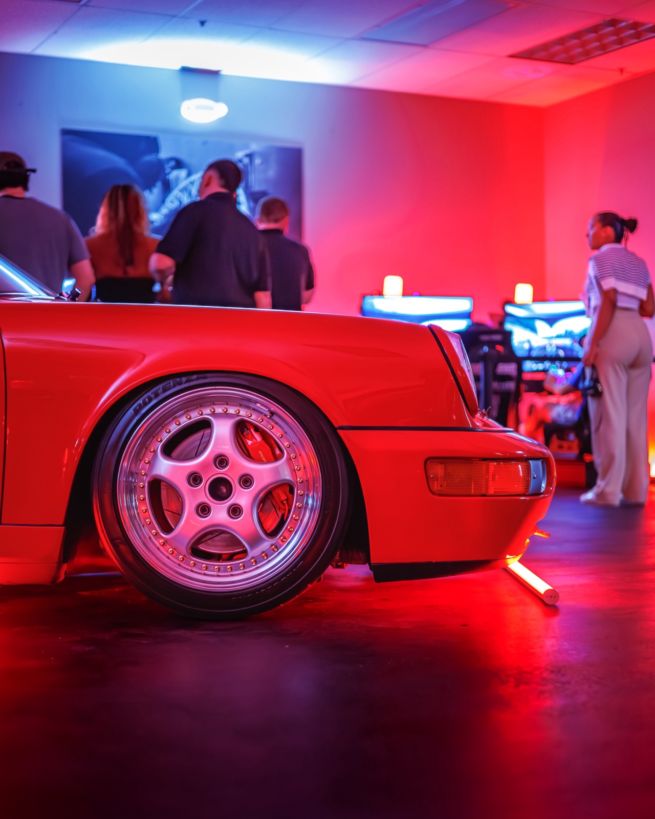 Crowd gathered around SimsForHire rigs at Art Basel event