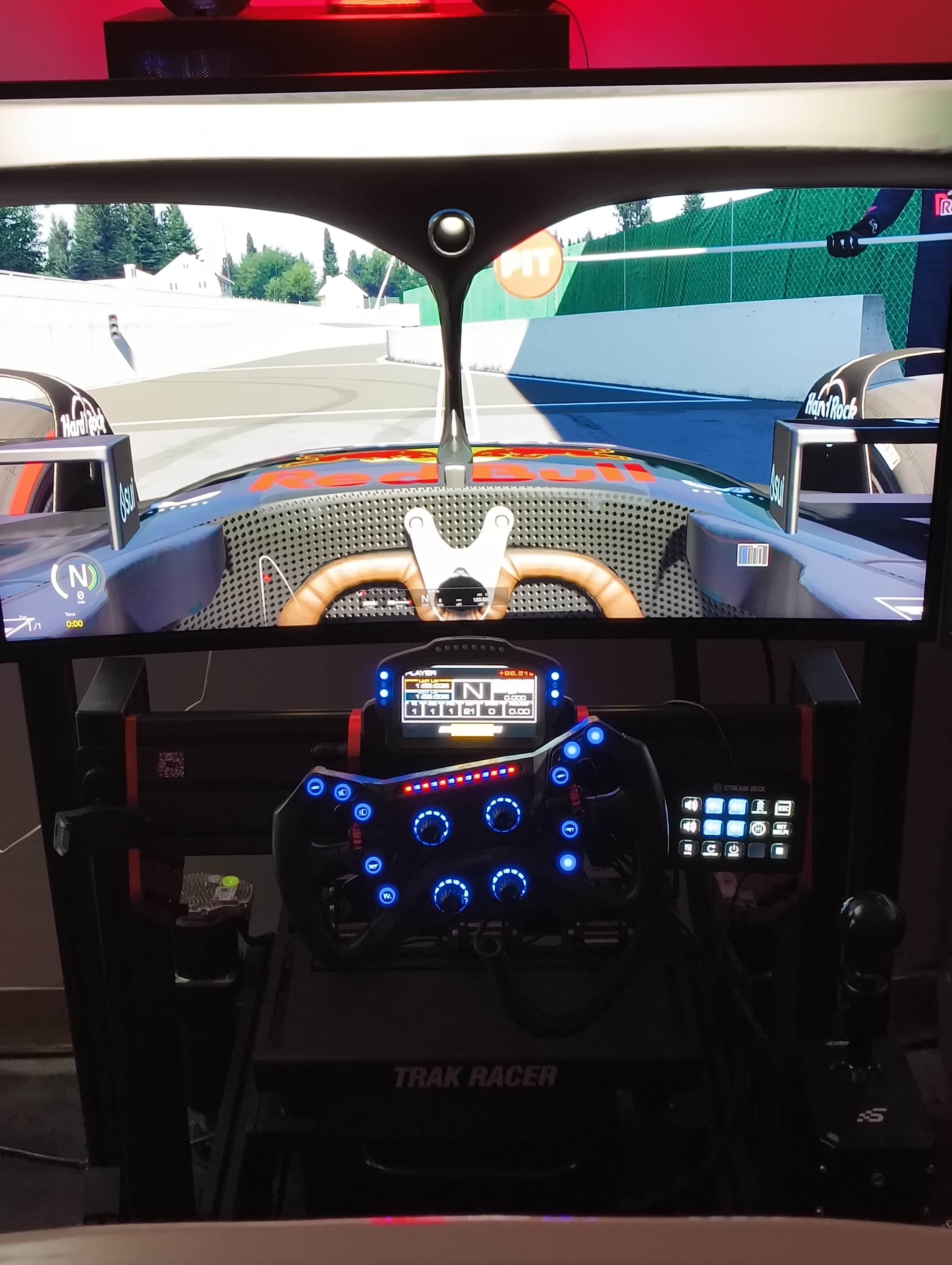 Night scene at OFFSPEC Miami with sim racing and car show