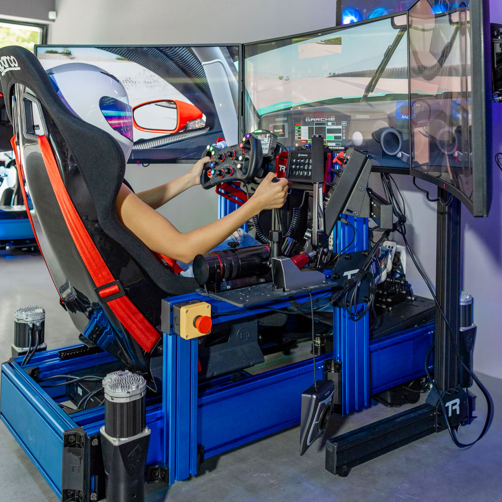 Full-motion racing simulator rig with triple screens in Lake Worth Beach