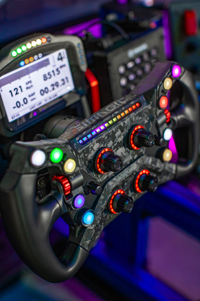 Full-motion racing simulator rig with triple screens in Pinecrest