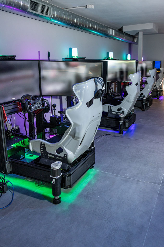 Full-motion racing simulator rig with triple screens in Delray Beach