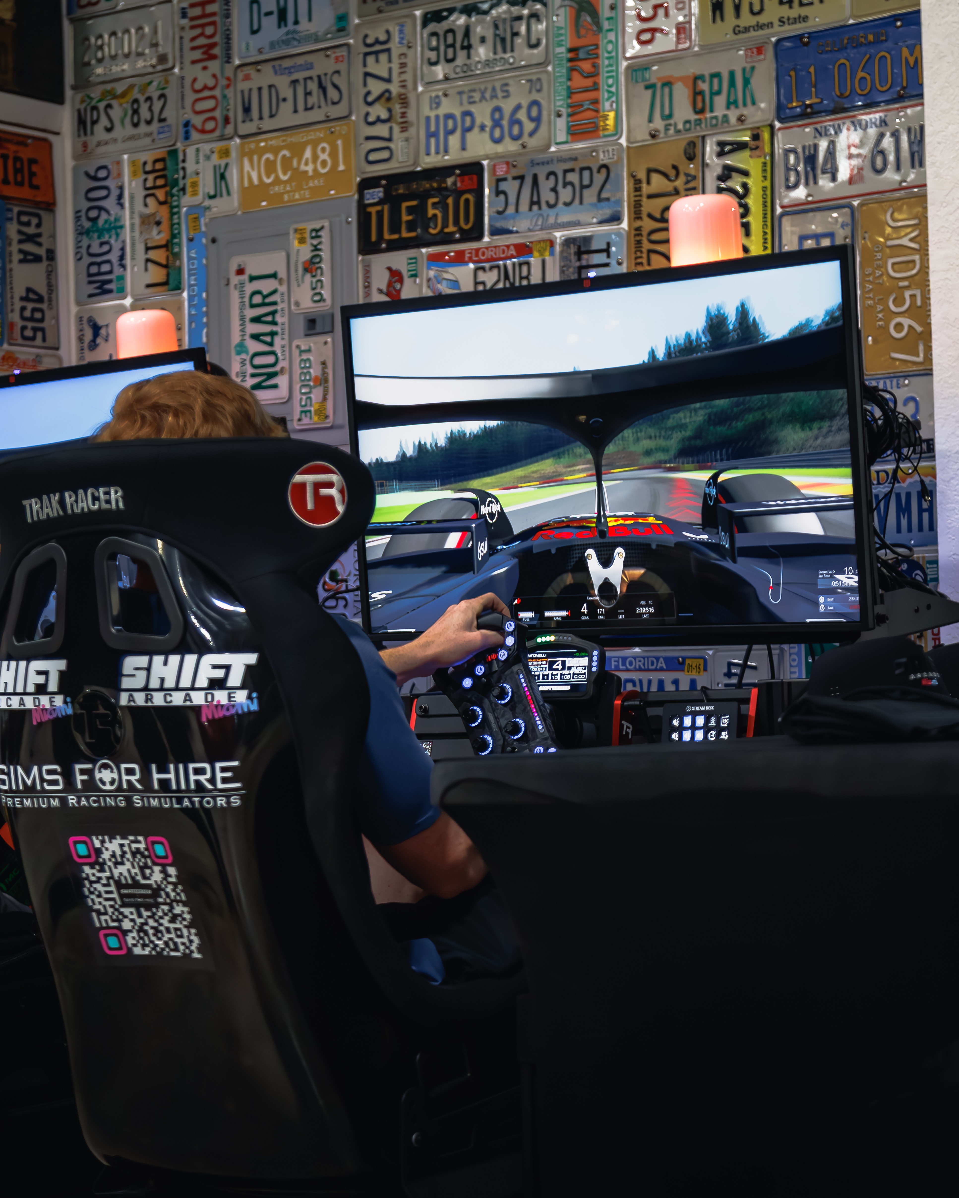 SimsForHire racing rig alongside exotic cars at RMC Miami